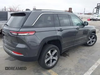 2022 Jeep Grand Cherokee with VIN 1C4RJYB68N8748802, listed as a IAAI auction lot 42158104 with 28,227 mi miles and . Bid and sale history available at DreamBid. Image 4.