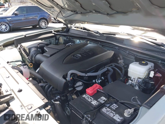 2023 Toyota Tacoma SR with VIN 3TMCZ5AN3PM590101, listed as a IAAI auction lot 42338670 with 12,970 mi miles and . Bid and sale history available at DreamBid. Image 10.