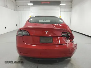 2023 Tesla Model 3 with VIN 5YJ3E1EA6PF455789, listed as a Copart auction lot 54715665 with 64,658 mi miles and Salvage Title. Bid and sale history available at DreamBid. Image 6.