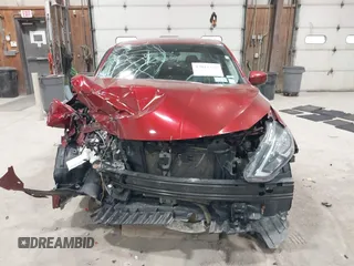 2019 Nissan Sentra S z VIN 3N1AB7AP7KY257283, wystawiony jako IAAI lot #42012338 z przebiegiem 103 503 mil mil oraz . Historia ofert i sprzedaży dostępna na DreamBid. Obrazek 13.
