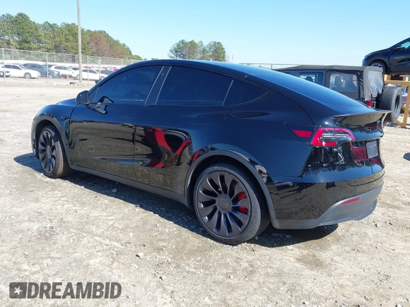 2021 Tesla Model Y Performance with VIN 5YJYGDEF6MF252877, listed as a IAAI auction lot 41770770 with 58,550 mi miles and . Bid and sale history available at DreamBid. Image 3.