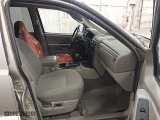 2003 Jeep Grand Cherokee Laredo with VIN 1J4GW48SX3C544237, listed as a IAAI auction lot 40823228 with 1 mi miles. Bid and sale history available at carsss.com. Image 5.