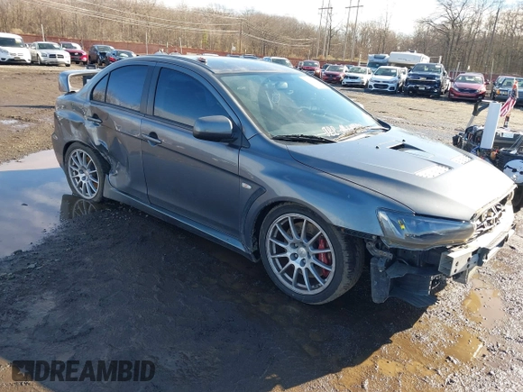 2008 Mitsubishi Lancer Evolution GSR with VIN JA3AW86V18U044077, listed as a IAAI auction lot 41208625 with 157,788 mi miles. Bid and sale history available at carsss.com. Image 1.