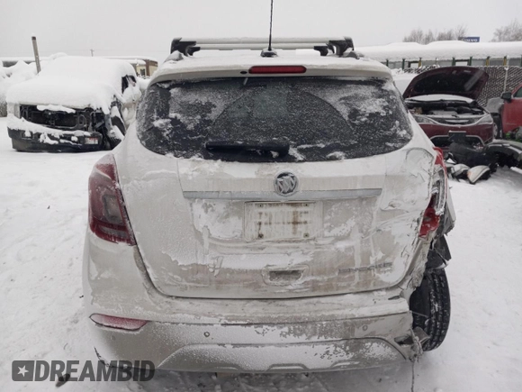 2019 Buick Encore Essence with VIN KL4CJGSM5KB738932, listed as a Copart auction lot 83087444 with 59,162 mi miles and Salvage Title. Bid and sale history available at DreamBid. Image 6.