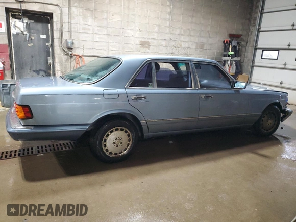 1986 Mercedes-Benz 560 with VIN WDBCA39DXGA213770, listed as a Copart auction lot 49787355 with 218,547 mi miles and Salvage Title. Bid and sale history available at DreamBid. Image 3.