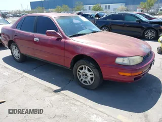 1992 Toyota Camry z VIN 4T1SK11E5NU082614, wystawiony jako IAAI lot #41998616 z przebiegiem 263 605 mil mil oraz . Historia ofert i sprzedaży dostępna na DreamBid. Obrazek 1.