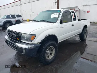 1999 Toyota Tacoma with VIN 4TAWN72N6XZ452890, listed as a IAAI auction lot 41485263 with 201,974 mi miles and . Bid and sale history available at DreamBid. Image 2.