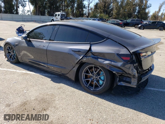 2023 Tesla Model 3 Long Range with VIN 5YJ3E1EB4PF633935, listed as a Copart auction lot 45238705 with 32,972 mi miles and Salvage Title. Bid and sale history available at DreamBid. Image 2.