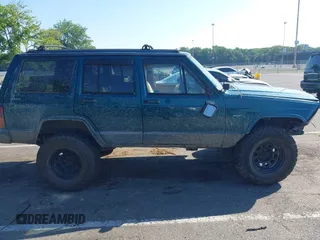 1995 Jeep Cherokee Sport z VIN 1J4FJ68S7SL623451, wystawiony jako IAAI lot #42581407 z przebiegiem 160 581 mil mil oraz . Historia ofert i sprzedaży dostępna na DreamBid. Obrazek 13.