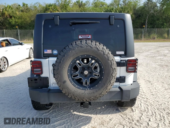 2018 Jeep Wrangler Unlimited Sport with VIN 1C4BJWDG3JL807080, listed as a Copart auction lot 74887824 with 51,559 mi miles and Non Repairable. Bid and sale history available at DreamBid. Image 6.