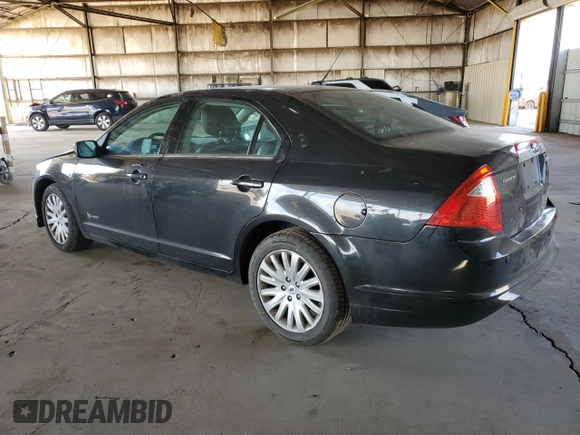 2012 Ford Fusion Hybrid с VIN 3FADP0L34CR416775, выставлен на аукционе Copart как лот 55108645 с пробегом 102 574 миль миль и Списание • Salvage title. История ставок и продаж доступна на DreamBid. Изображение 2.