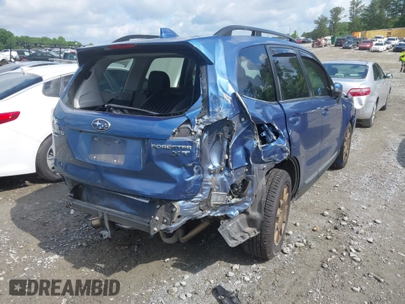 2017 Subaru Forester Touring with VIN JF2SJGWC2HH467144, listed as a IAAI auction lot 42319496 with 122,845 mi miles and . Bid and sale history available at DreamBid. Image 4.