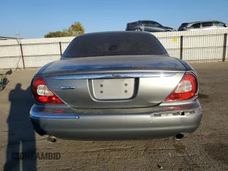 2004 Jaguar XJ with VIN SAJWA71C74SG20299, listed as a Copart auction lot 79469504 with 78,134 mi miles and Salvage Title. Bid and sale history available at carsss.com. Image 6.