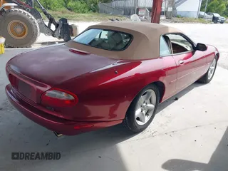 1997 Jaguar XK with VIN SAJGX274XVC004952, listed as a IAAI auction lot 42211023 with 109,889 mi miles and . Bid and sale history available at DreamBid. Image 4.