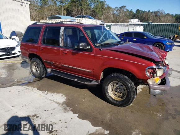 1997 Ford Explorer XL with VIN 1FMDU32E8VZC21604, listed as a Copart auction lot 81987654 with 156,141 mi miles and Salvage title. Bid and sale history available at DreamBid. Image 4.