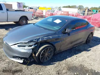 2017 Tesla Model S 100D with VIN 5YJSA1E27HF231755, listed as a IAAI auction lot 41351997 with 127,729 mi miles. Bid and sale history available at carsss.com. Image 2.
