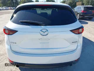 2020 Mazda CX-5 Touring with VIN JM3KFACM6L0737727, listed as a IAAI auction lot 41283200 with 85,949 mi miles and . Bid and sale history available at carsss.com. Image 16.