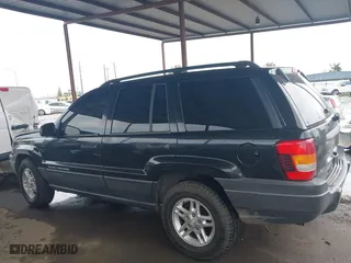 2004 Jeep Grand Cherokee Laredo with VIN 1J4GX48N94C435700, listed as a IAAI auction lot 41809624 with 147,413 mi miles. Bid and sale history available at carsss.com. Image 14.
