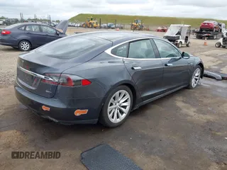 2016 Tesla Model S 90D with VIN 5YJSA1E27GF129824, listed as a IAAI auction lot 42058080 with 113,171 mi miles and . Bid and sale history available at DreamBid. Image 4.
