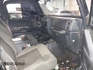 1999 Jeep Wrangler Sahara z VIN 1J4FY49S4XP432567, wystawiony jako IAAI lot #41562455 z przebiegiem Nie podano mil oraz . Historia ofert i sprzedaży dostępna na DreamBid. Obrazek 5.