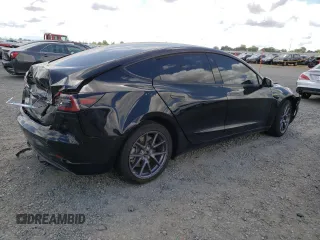 2023 Tesla Model 3 with VIN 5YJ3E1EA6PF454254, listed as a Copart auction lot 56881355 with 30,327 mi miles and Salvage title. Bid and sale history available at DreamBid. Image 3.