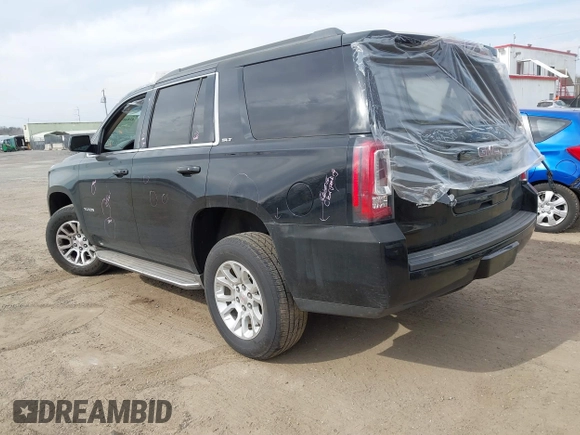 2015 GMC Yukon SLT z VIN 1GKS1BKCXFR192349, wystawiony jako IAAI lot #41842474 z przebiegiem 185 166 mil mil oraz . Historia ofert i sprzedaży dostępna na DreamBid. Obrazek 3.