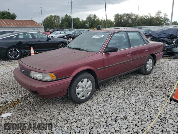 1991 Toyota Camry DLX z VIN 4T1SV21E0MU450578, wystawiony jako Copart lot #73990024 z przebiegiem 149 342 mil mil oraz Czysty tytuł • Clean title. Historia ofert i sprzedaży dostępna na DreamBid. Obrazek 1.
