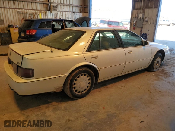 1993 Cadillac Seville Touring STS z VIN 1G6KY5295PU817593, wystawiony jako Copart lot #47807075 z przebiegiem Nie podano mil oraz Czysty tytuł • Clean title. Historia ofert i sprzedaży dostępna na DreamBid. Obrazek 3.