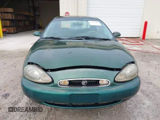 1999 Mercury Sable GS with VIN 1MEFM50U5XG633589, listed as a IAAI auction lot 41614442 with 241,833 mi miles. Bid and sale history available at carsss.com. Image 6.