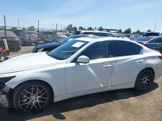 2014 Infiniti Q50 Hybrid Premium z VIN JN1AV7AP3EM690226, wystawiony jako IAAI lot #42259111 z przebiegiem 140 424 mil mil oraz . Historia ofert i sprzedaży dostępna na DreamBid. Obrazek 15.