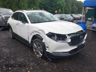 2022 Mazda CX-30 S Premium with VIN 3MVDMBDL4NM431739, listed as a IAAI auction lot 42614875 with 21,848 mi miles and . Bid and sale history available at DreamBid. Image 1.