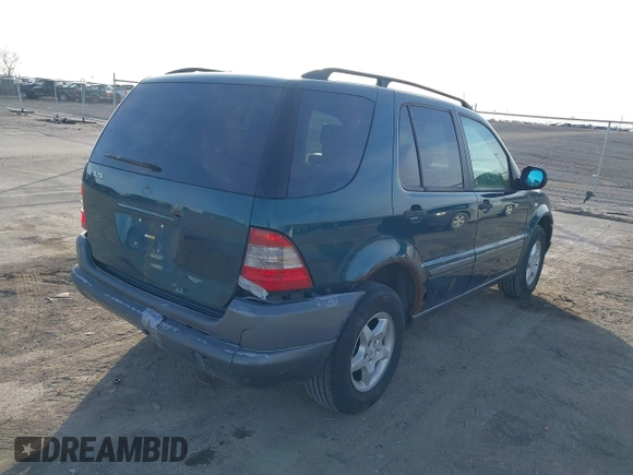 1998 Mercedes-Benz M-Class with VIN 4JGAB54E7WA034632, listed as a IAAI auction lot 41523291 with 153,241 mi miles. Bid and sale history available at carsss.com. Image 13.