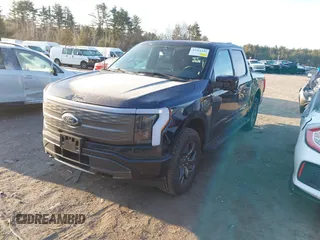 2023 Ford F-150 Lightning Pro with VIN 1FT6W1EV7PWG33511, listed as a IAAI auction lot 41761149 with 10,501 mi miles and . Bid and sale history available at DreamBid. Image 2.