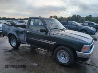1994 Toyota Pickup DX with VIN JT4RN81PXR5174113, listed as a Copart auction lot 64211905 with 209,694 mi miles and Salvage title. Bid and sale history available at DreamBid. Image 4.