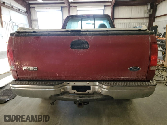 1999 Ford F-150 with VIN 1FTRF18W8XNB97257, listed as a Copart auction lot 87857815 with Not provided miles and Salvage title. Bid and sale history available at DreamBid. Image 6.