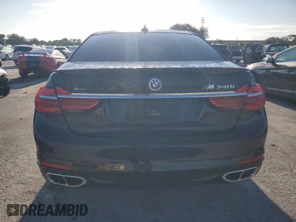 2017 BMW 7 Series 740i xDrive with VIN WBA7E4C34HGU99964, listed as a Copart auction lot 69808464 with 93,423 mi miles and Non Repairable. Bid and sale history available at carsss.com. Image 6.