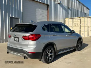 2017 BMW X1 sDrive28i with VIN WBXHU7C39H5H34971, listed as a Copart auction lot 51869265 with 108,051 mi miles and Clean Title. Bid and sale history available at carsss.com. Image 4.