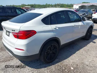 2015 BMW X4 xDrive28i with VIN 5UXXW3C59F0M88331, listed as a IAAI auction lot 42093953 with 138,205 mi miles and . Bid and sale history available at DreamBid. Image 4.