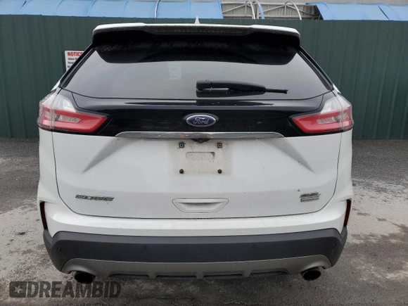 2020 Ford Edge SEL z VIN 2FMPK3J90LBB01559, wystawiony jako Copart lot #61365305 z przebiegiem 120 050 mil mil oraz Czysty tytuł • Clean title. Historia ofert i sprzedaży dostępna na DreamBid. Obrazek 6.