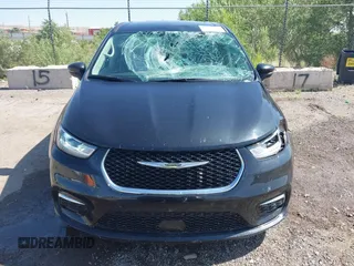 2023 Chrysler Pacifica Touring L with VIN 2C4RC1BG9PR628170, listed as a IAAI auction lot 42515590 with 41,987 mi miles and . Bid and sale history available at DreamBid. Image 12.