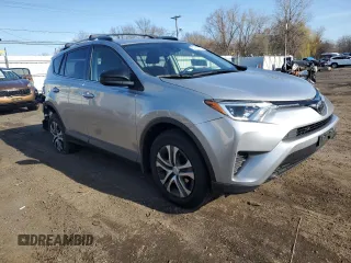 2018 Toyota RAV4 LE with VIN JTMBFREVXJJ220838, listed as a Copart auction lot 52870975 with 125,456 mi miles and Salvage Title. Bid and sale history available at carsss.com. Image 4.
