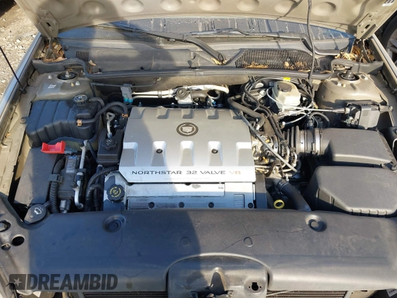 2002 Cadillac DeVille DHS z VIN 1G6KE57Y22U225134, wystawiony jako IAAI lot #41350531 z przebiegiem 126 457 mil mil oraz . Historia ofert i sprzedaży dostępna na DreamBid. Obrazek 10.