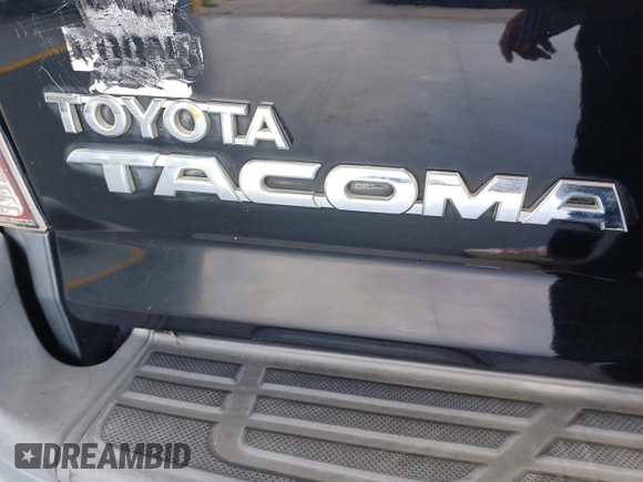 2014 Toyota Tacoma with VIN 3TMMU4FN8EM068633, listed as a IAAI auction lot 42727713 with 185,402 mi miles and . Bid and sale history available at DreamBid. Image 13.