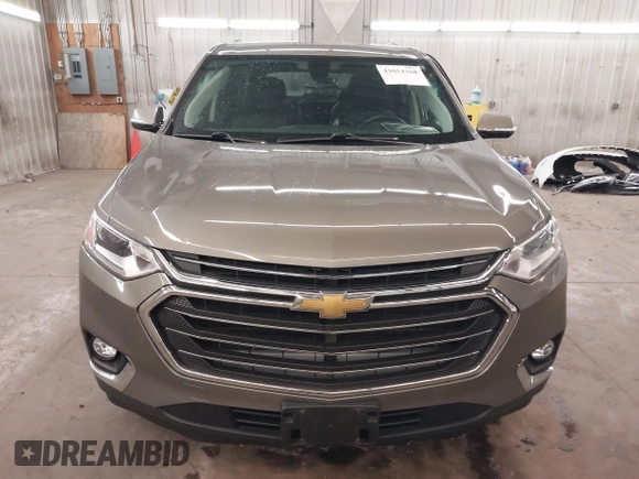 2018 Chevrolet Traverse LT z VIN 1GNEVHKW0JJ166321, wystawiony jako IAAI lot #42014168 z przebiegiem 81 442 mil mil oraz . Historia ofert i sprzedaży dostępna na DreamBid. Obrazek 13.