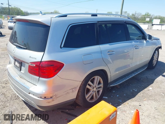 2014 Mercedes-Benz GL 450 z VIN 4JGDF7CE4EA347876, wystawiony jako IAAI lot #42386949 z przebiegiem 133 400 mil mil oraz . Historia ofert i sprzedaży dostępna na DreamBid. Obrazek 4.