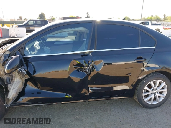 2014 Volkswagen Jetta SE z VIN 3VWD17AJ4EM419839, wystawiony jako IAAI lot #41994141 z przebiegiem 102 068 mil mil oraz . Historia ofert i sprzedaży dostępna na DreamBid. Obrazek 14.