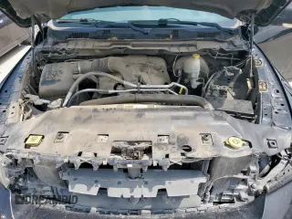 2015 Ram 1500 Outdoorsman z VIN 1C6RR6LT9FS566376, wystawiony jako Copart lot #57241255 z przebiegiem 130 919 mil mil oraz Szkoda całkowita • Salvage title. Historia ofert i sprzedaży dostępna na DreamBid. Obrazek 11.