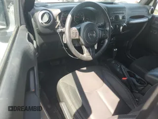 2015 Jeep Wrangler Sahara with VIN 1C4AJWBG1FL705900, listed as a Copart auction lot 62353275 with 64,866 mi miles and Salvage title. Bid and sale history available at DreamBid. Image 8.