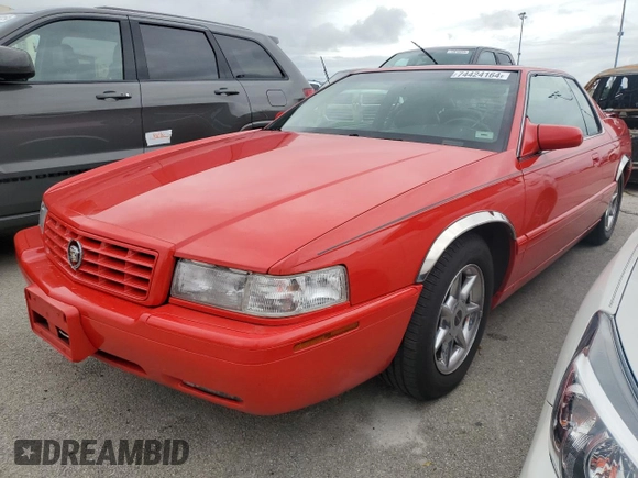 2002 Cadillac Eldorado z VIN 1G6EC129X2B106142, wystawiony jako Copart lot #74424164 z przebiegiem Nie podano mil oraz Szkoda całkowita • Salvage title. Historia ofert i sprzedaży dostępna na DreamBid. Obrazek 1.