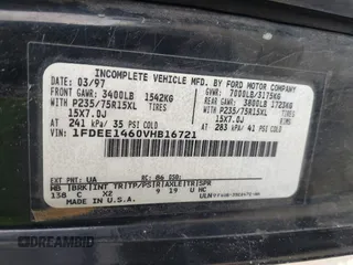 1997 Ford Econoline Commercial with VIN 1FDEE1460VHB16721, listed as a IAAI auction lot 40968310 with 261,169 mi miles. Bid and sale history available at carsss.com. Image 9.